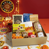 Diwali Gift Hamper that includes Nuts & Honey, Cashew, Almonds, Makhana, Ragi Chips, Multigrain Cookies, Filter Coffee, Green Tea, Ganesha Figurine & Candle