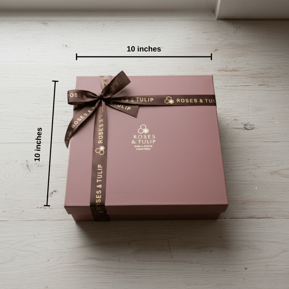 Brown gift box with a brown ribbon and 'Roses & Tulip' branding, measured at 10x10 inches on a light wooden surface.