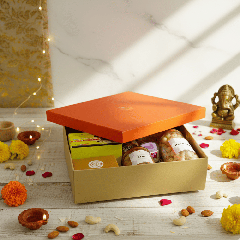 Diwali Gift Hamper that includes Nuts & Honey, Cashew, Almonds, Makhana, Ragi Chips, Multigrain Cookies, Filter Coffee, Green Tea, Ganesha Figurine & Candle