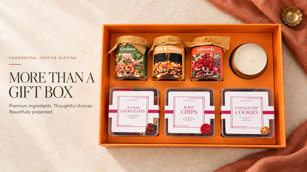 Open Roses & Tulip festive hamper with nuts, Nuts & Honey, ragi chips, cookies, chocolates and a candle
