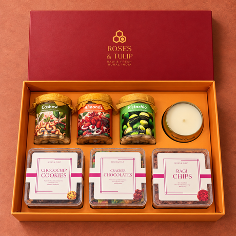 Open red and orange gift hamper showing three jars, a scented candle and three snack boxes