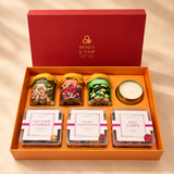 Closer view of the jars, candle and snack boxes inside the gift hamper